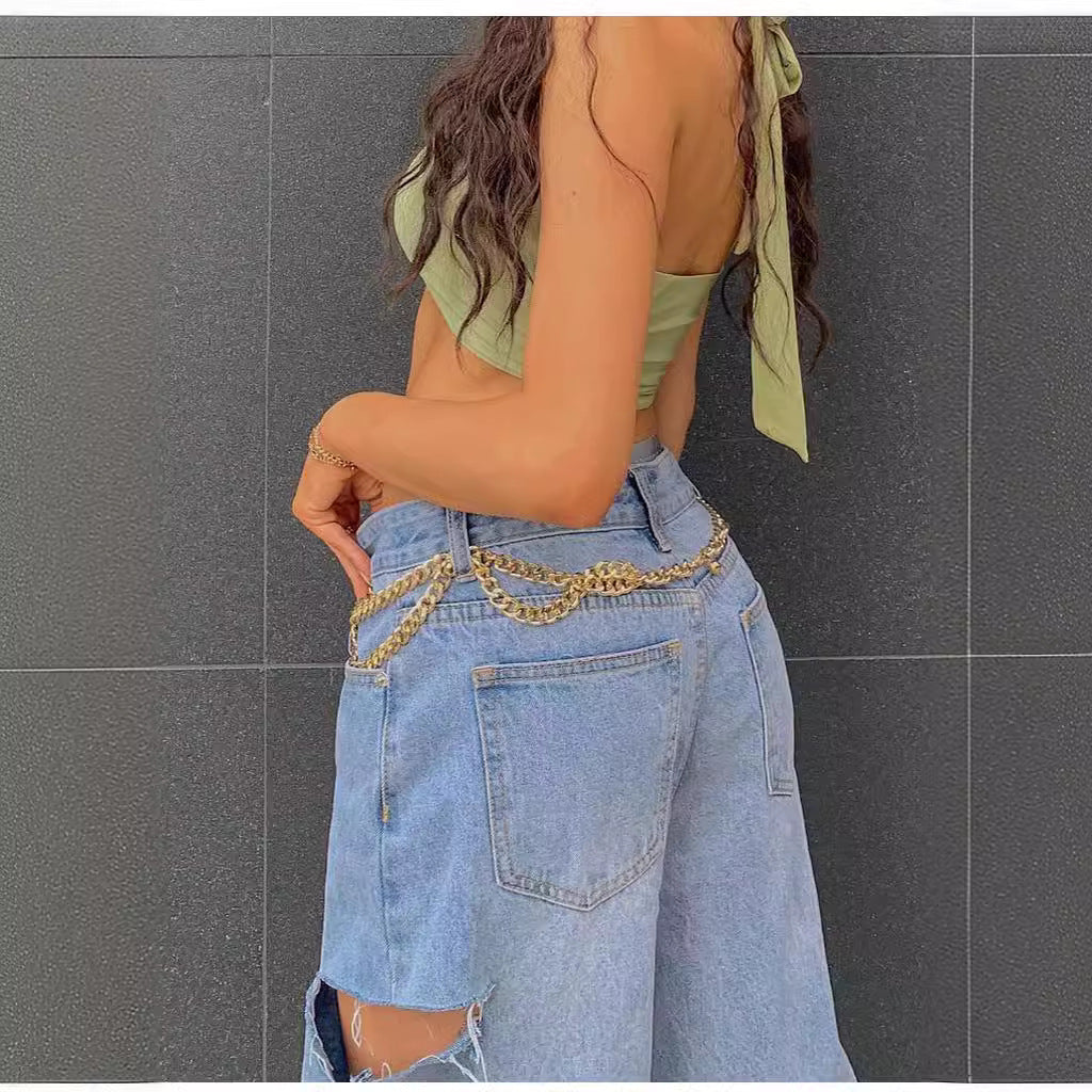 Loose Hole Jeans with Fashionable Oblique Waist Design for Style